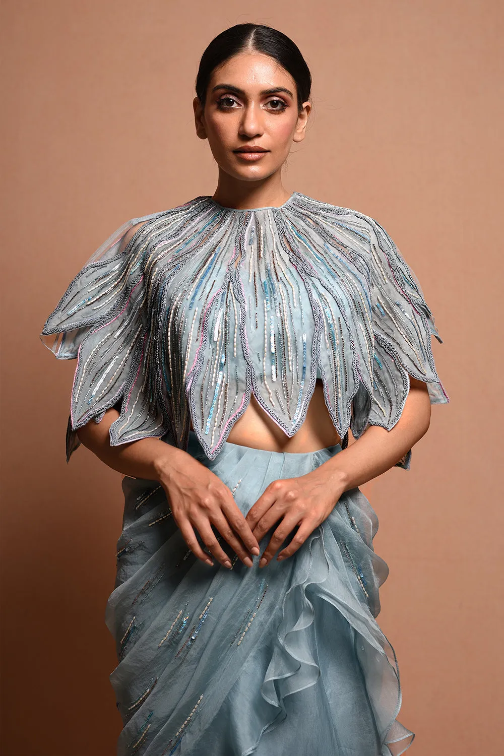 Foliage Saree Gown Features Petalfoliage Cape Embellished In Artwork Portraying Petals, It Is Scalloped With Knoted Yarn And Appliqued With Silk Organza.