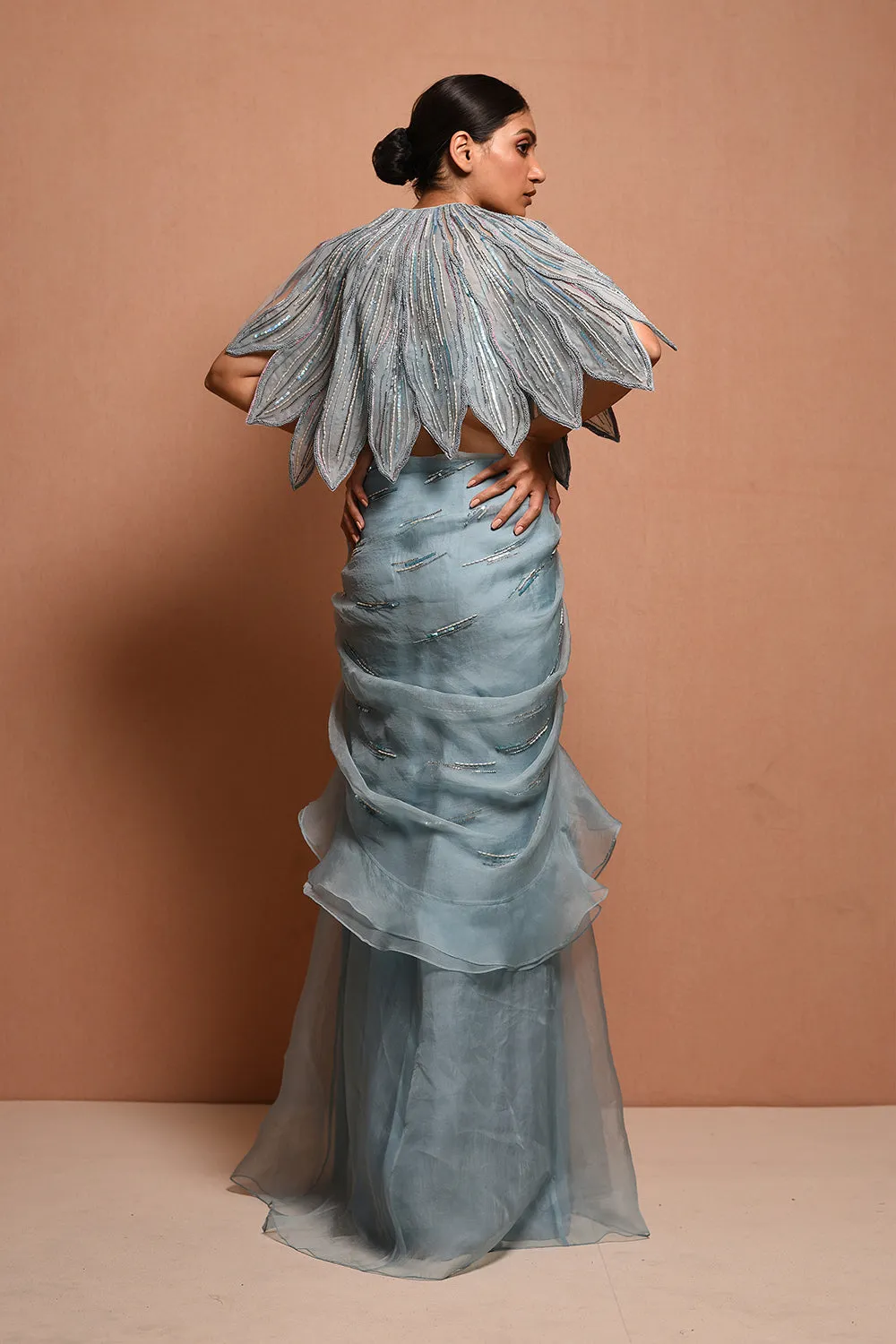 Foliage Saree Gown Features Petalfoliage Cape Embellished In Artwork Portraying Petals, It Is Scalloped With Knoted Yarn And Appliqued With Silk Organza.