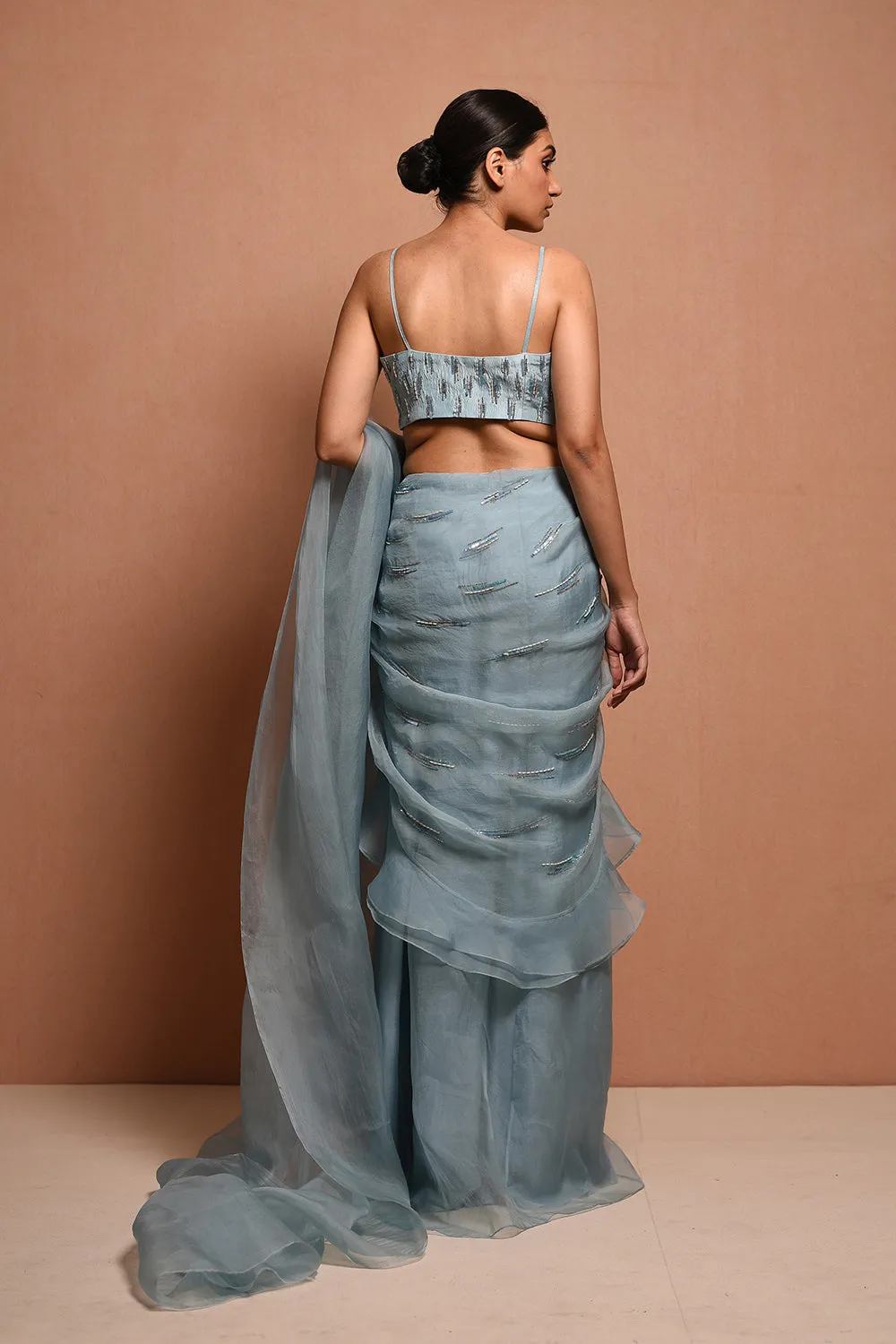 Foliage Saree Gown Features Petalfoliage Cape Embellished In Artwork Portraying Petals, It Is Scalloped With Knoted Yarn And Appliqued With Silk Organza.