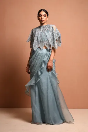 Foliage Saree Gown Features Petalfoliage Cape Embellished In Artwork Portraying Petals, It Is Scalloped With Knoted Yarn And Appliqued With Silk Organza.