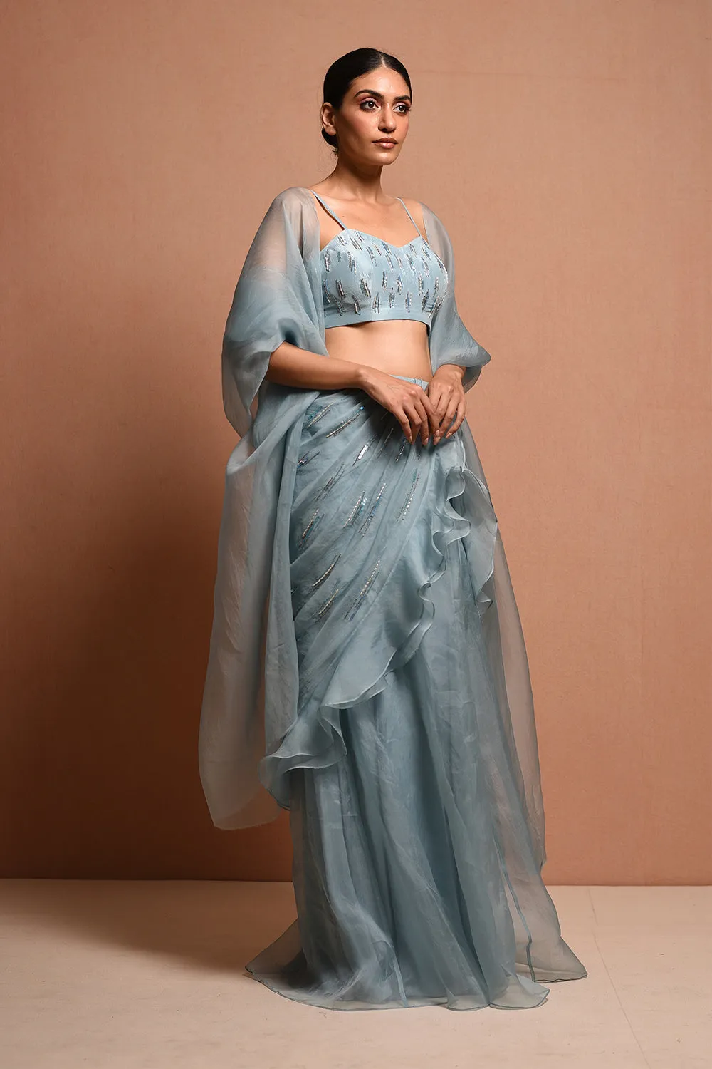 Foliage Saree Gown Features Petalfoliage Cape Embellished In Artwork Portraying Petals, It Is Scalloped With Knoted Yarn And Appliqued With Silk Organza.