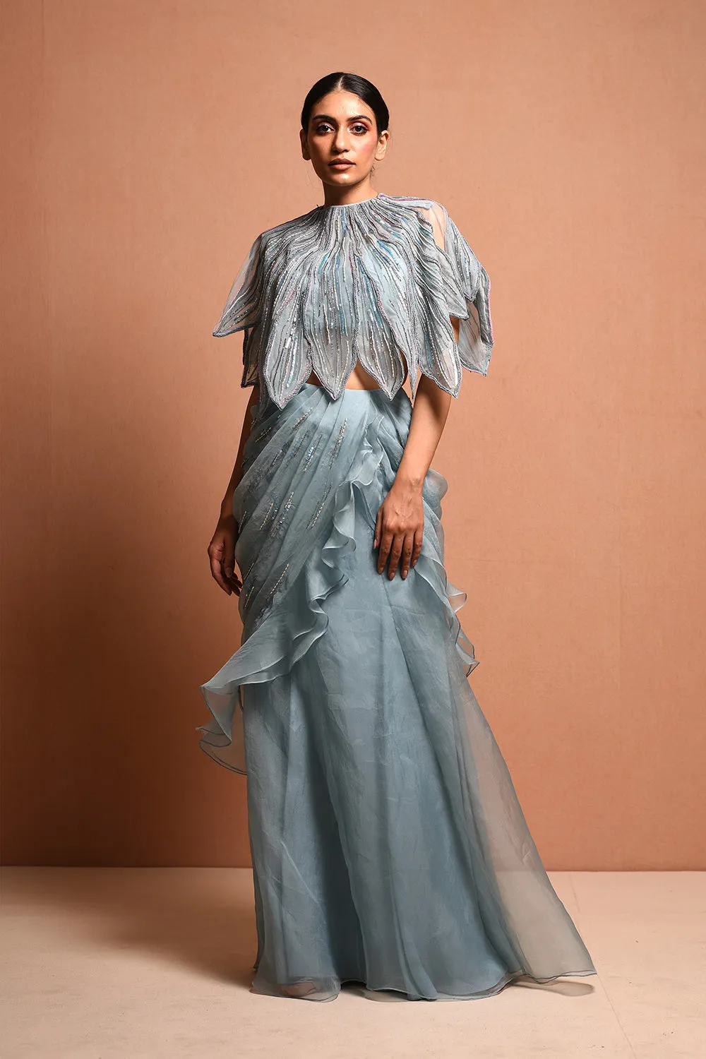 Foliage Saree Gown Features Petalfoliage Cape Embellished In Artwork Portraying Petals, It Is Scalloped With Knoted Yarn And Appliqued With Silk Organza.