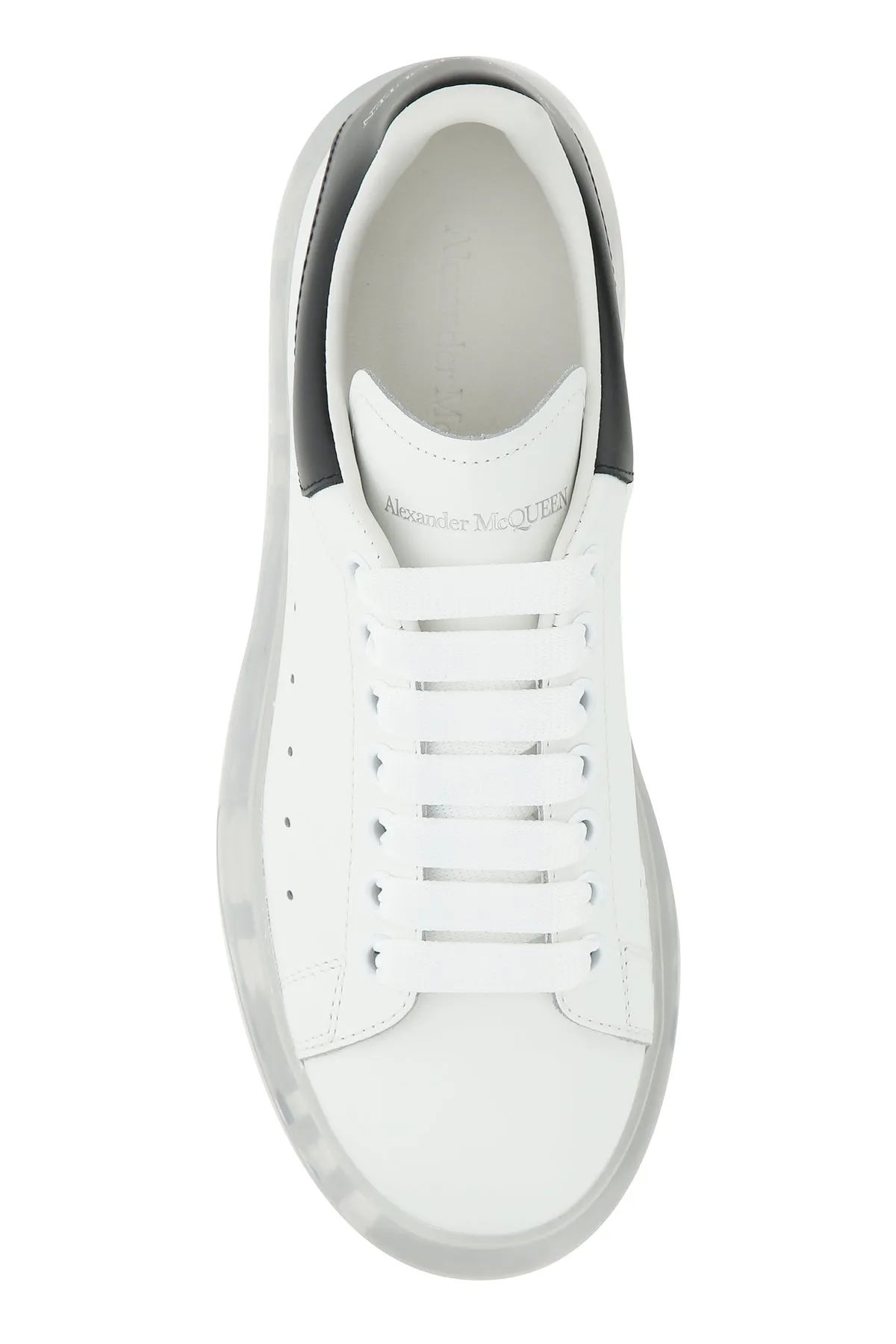 White leather sneakers with black heel