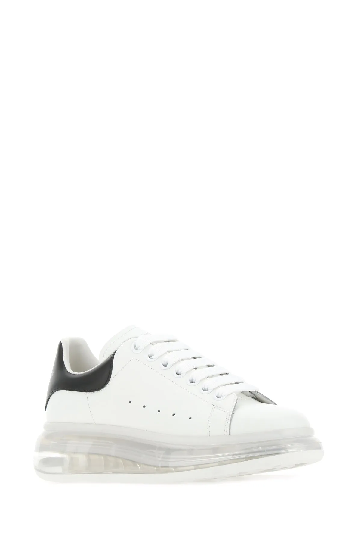 White leather sneakers with black heel
