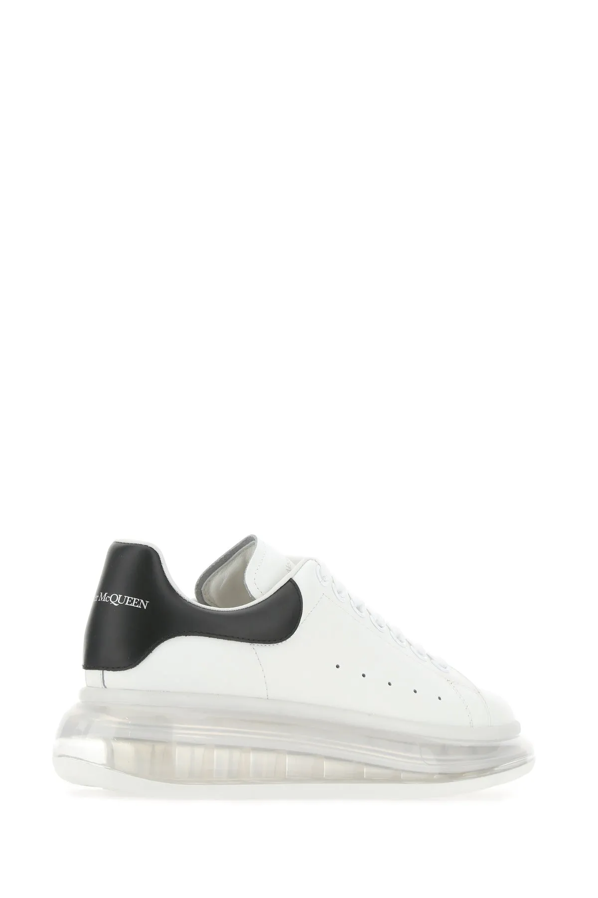White leather sneakers with black heel