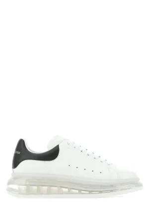 White leather sneakers with black heel